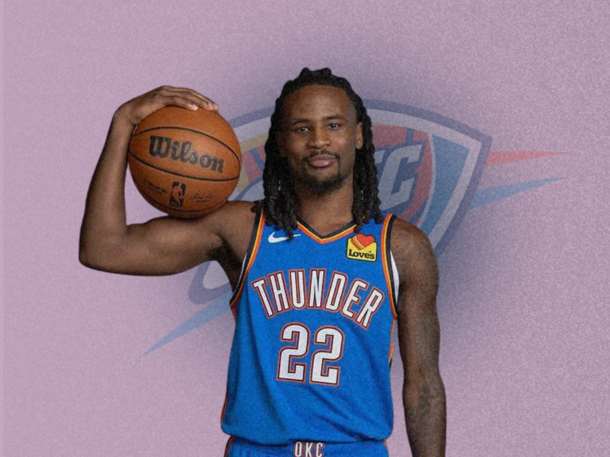 Wallace posing with a basketball in his Oklahoma City uniform amidst Cason Wallace $25M AAV Thunder extension negotiations.