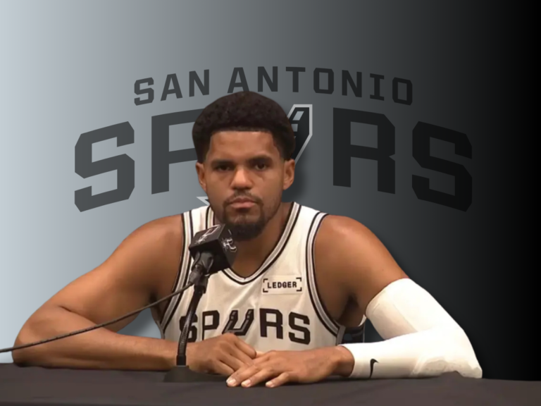 San Antonio Spurs forward Tobias Harris speaks at a podium microphone before medical updates regarding a Tobias Harris calf strain.